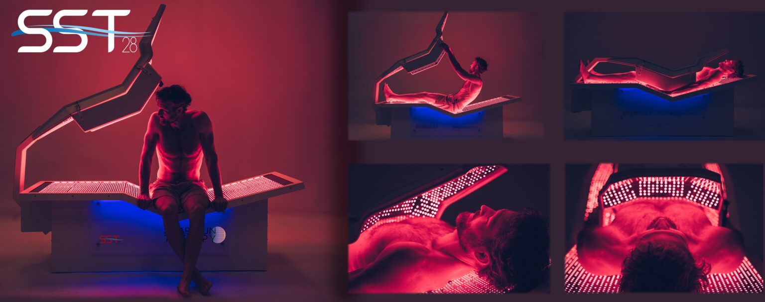 A man is sitting on a bed with red lights on it.