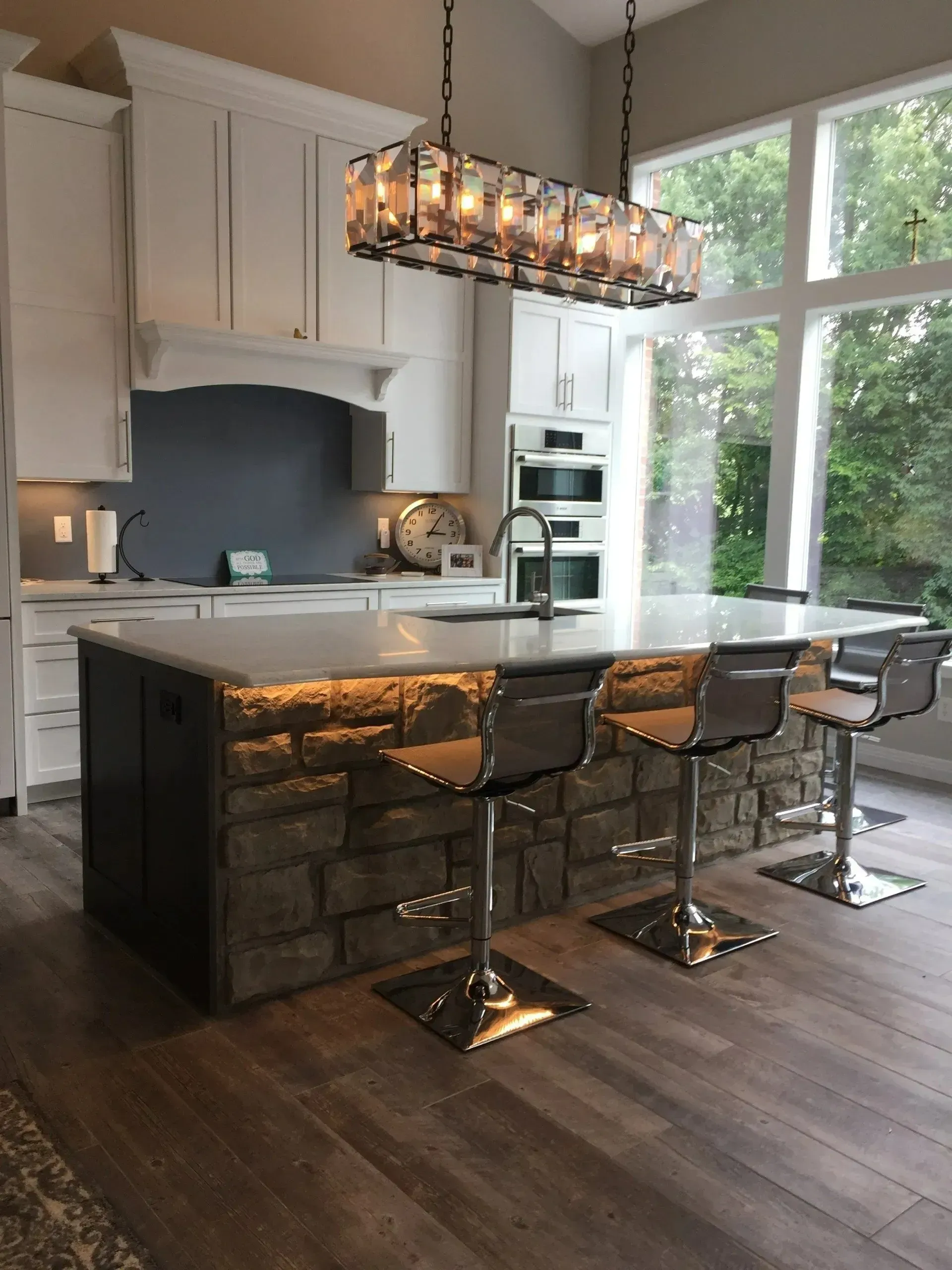 A kitchen with a large island and stools