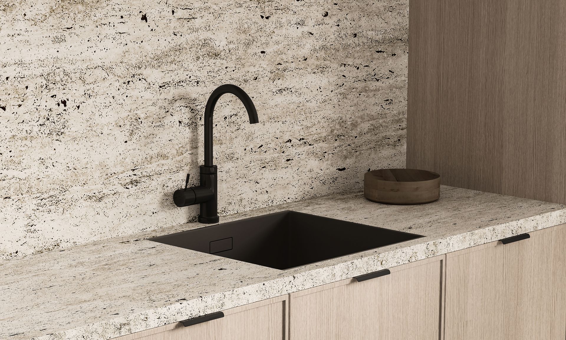 Modern kitchen counter with black sink and faucet, light wood cabinets, and a speckled stone backsplash