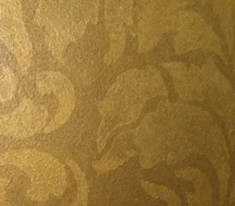 Gold wallpaper with a repeating floral pattern.