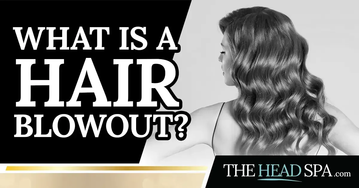 Back view of a woman with long, voluminous wavy blowout-styled hair