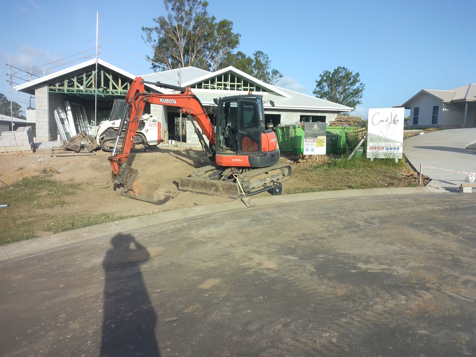A Bulldozer Is Sitting In Front Of A House — Ant's Earthworks In North Deep Creek, QLD