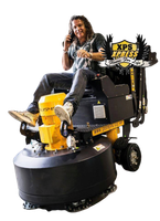 Man smiling while riding a yellow and black XPS Express floor machine on a white background