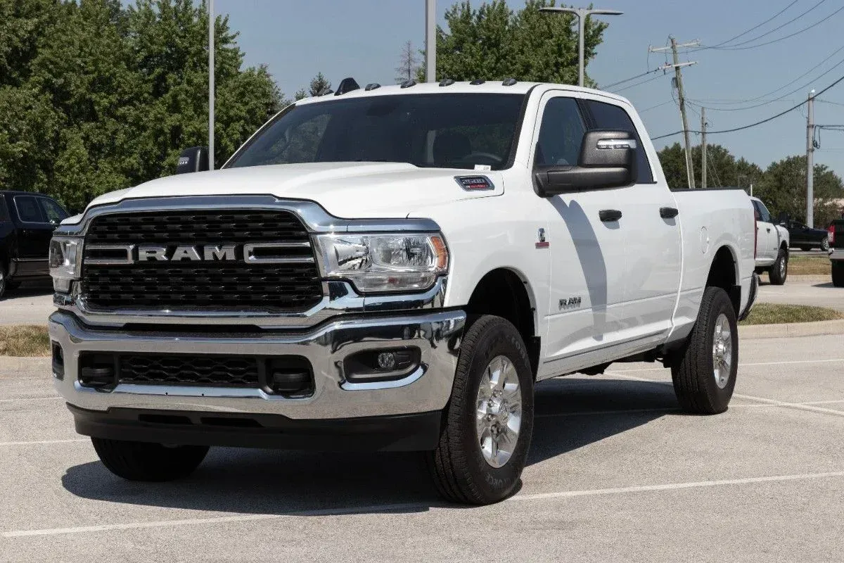 White Ram pickup truck parked outdoors on a sunny day