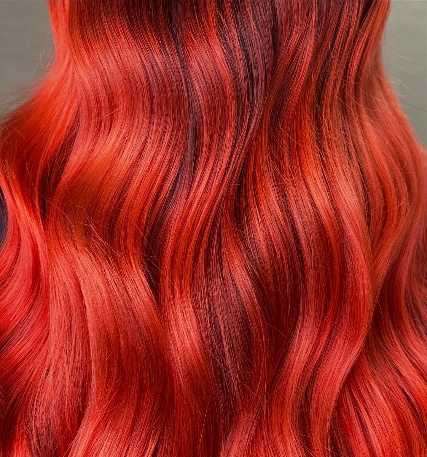 Close-up Of Wavy, Vibrant Red And Orange Hair With Dark Lowlights — Blackwell Hair In Woree, QLD