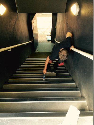 Person vacuuming carpet stairs - Flooring in Alice Springs, NT