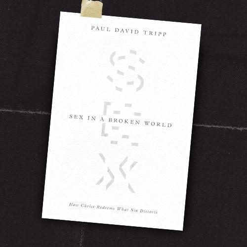 A white book cover on a dark surface, titled “Sex in a Broken World” by Paul David Tripp.