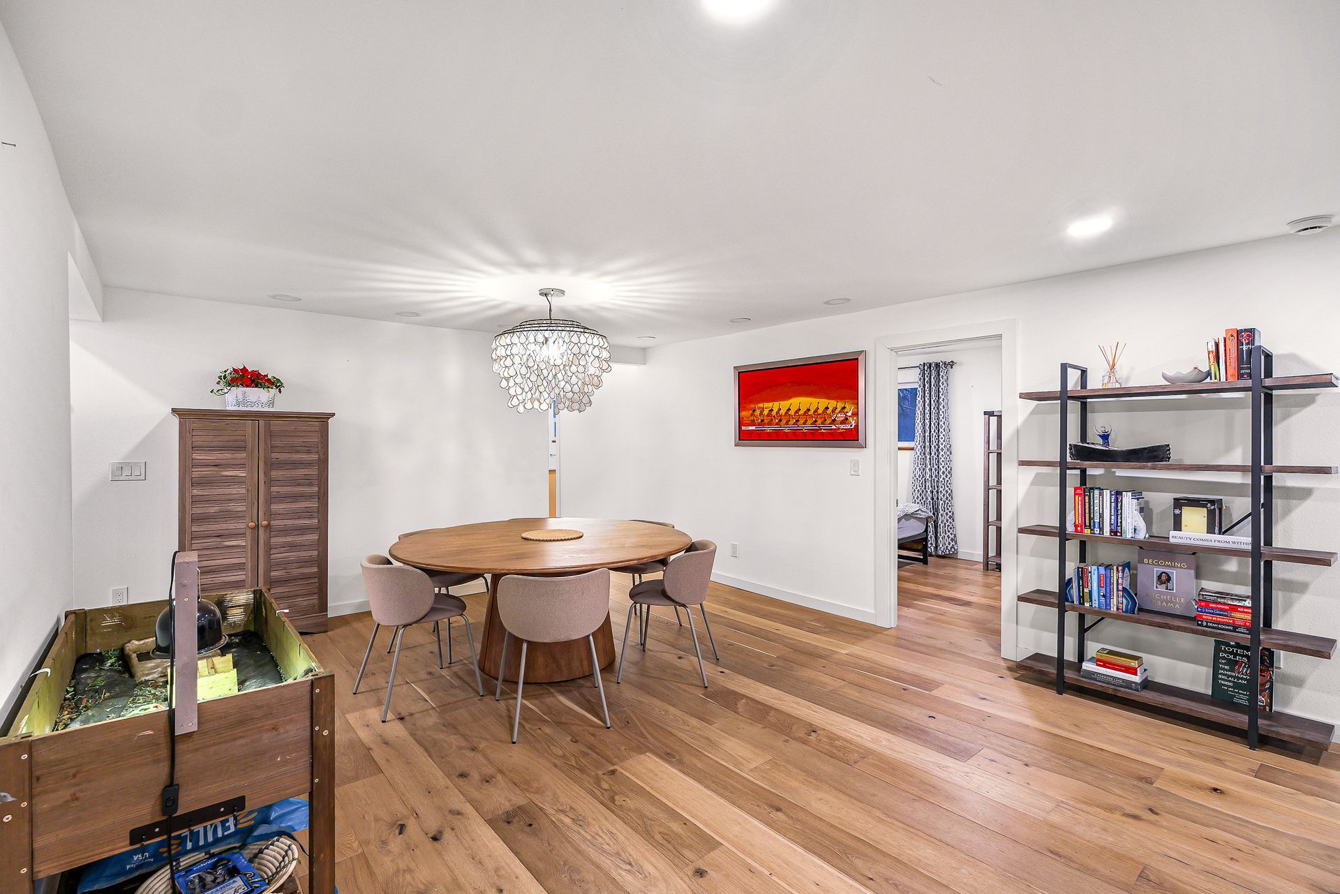 Dining room at 2155 Postal Avenue with chandelier and table.
