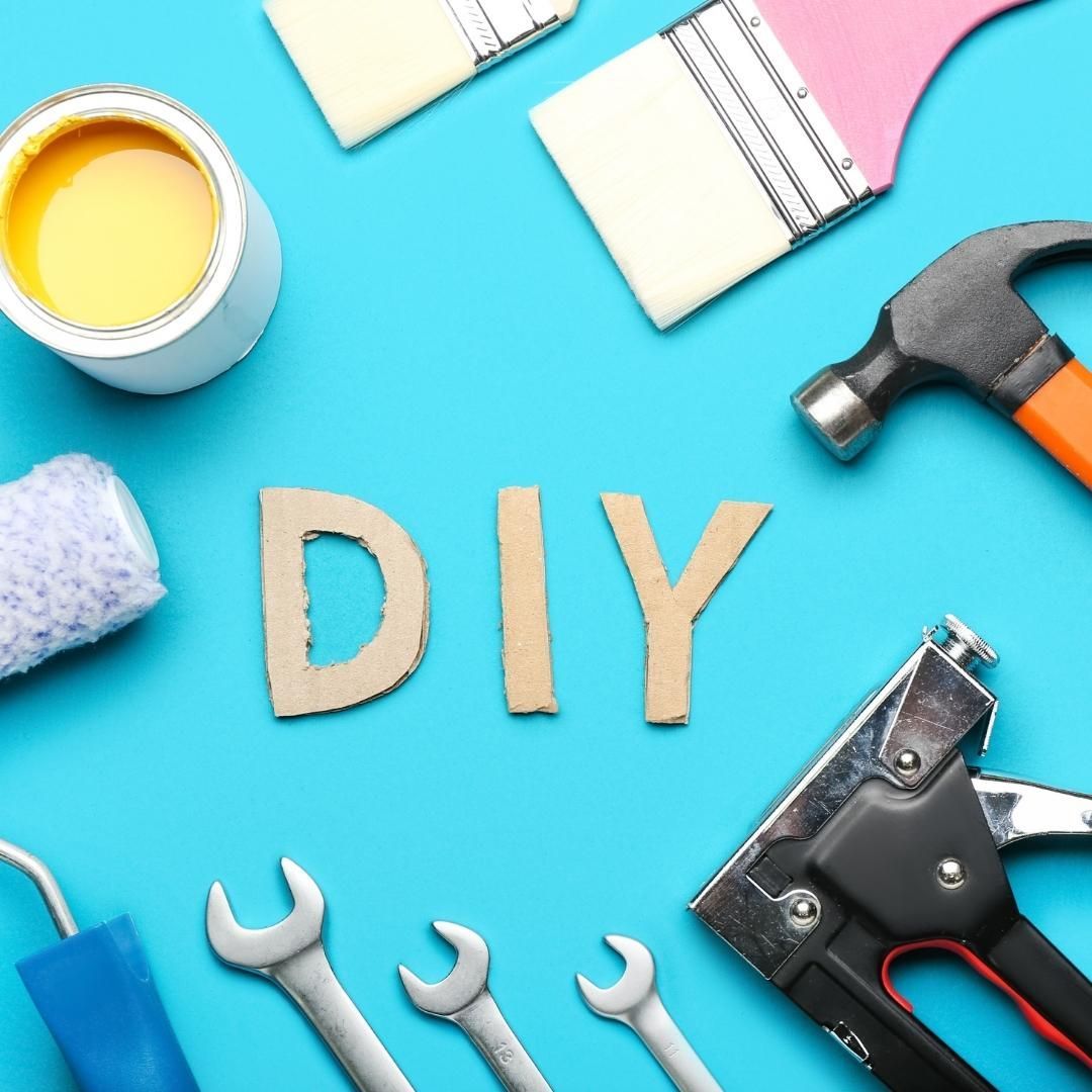 The word diy is surrounded by tools on a blue background