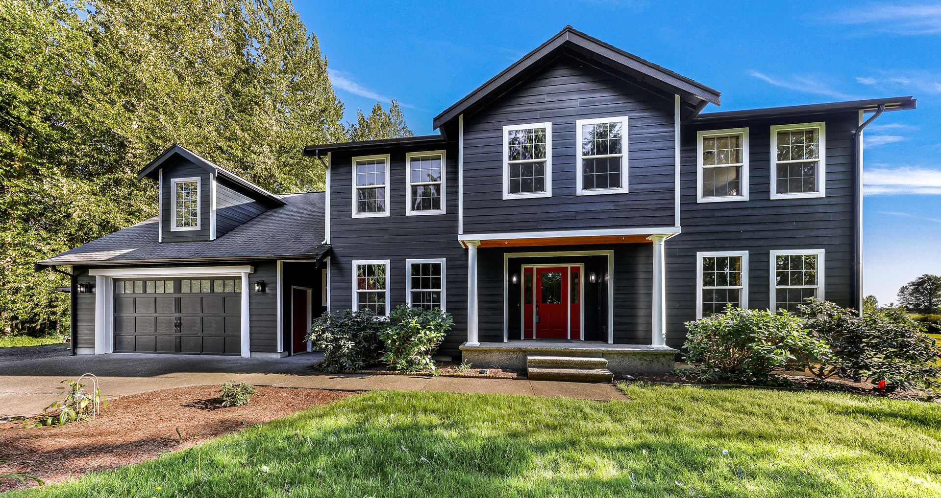 Home exterior with new paint and attached garage in Everson WA