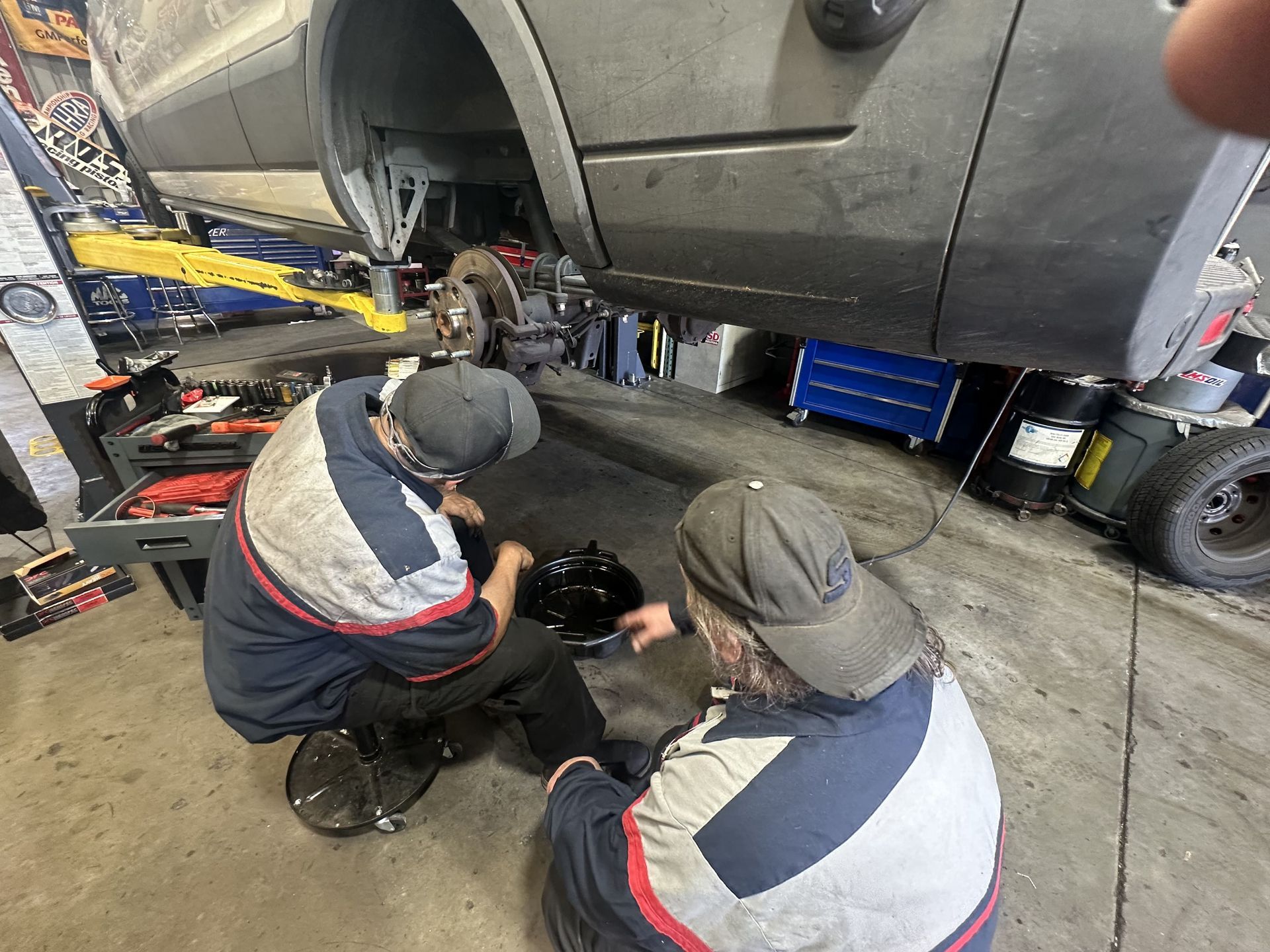 Mechanics at Wilson Motorsports performing general maintenance on a vehicle