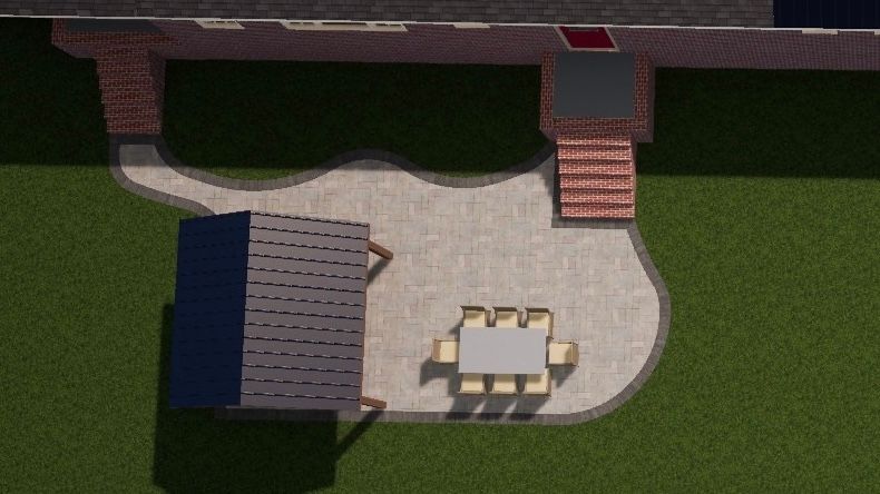 Overhead view of a patio with table and chairs, adjacent to a grassy yard and a building with brick steps.