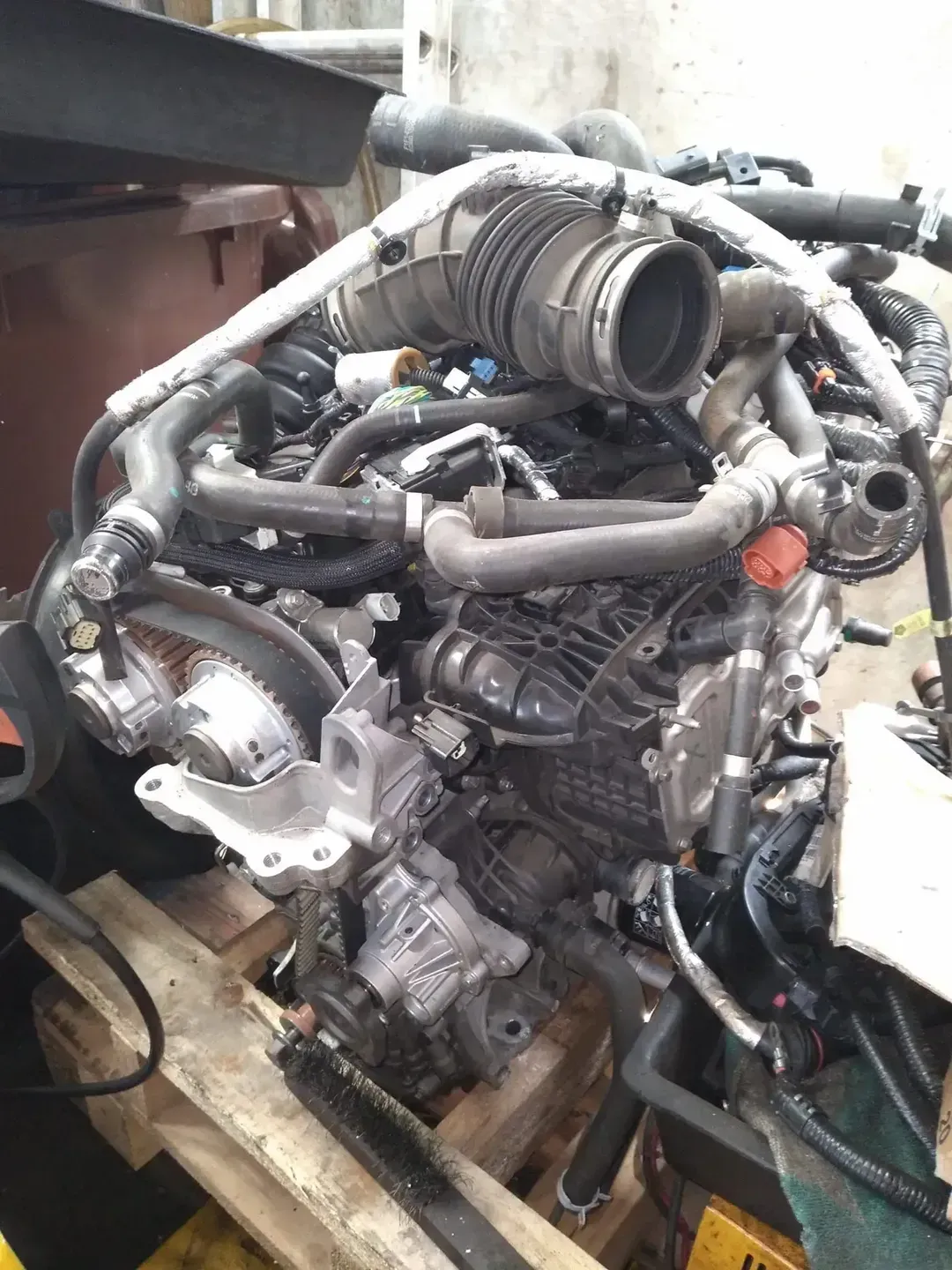 A Car Engine Is Sitting On Top Of A Wooden Pallet — Headland Auto Servicing & Air Conditioning In Alexandra Headland, QLD