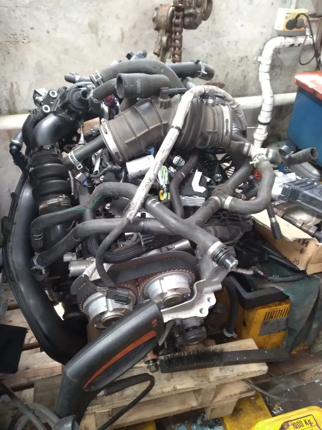 A Car Engine Is Sitting On Top Of A Wooden Pallet — Headland Auto Servicing & Air Conditioning In Alexandra Headland, QLD