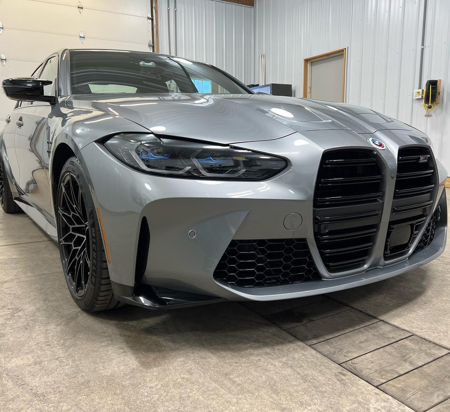 car with paint protection film parked inside the shop