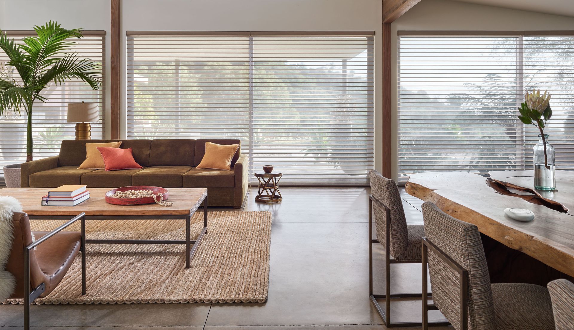 Boho living room with Hunter Douglas Silhouette® Window Shadings, layered textures, and earthy tones