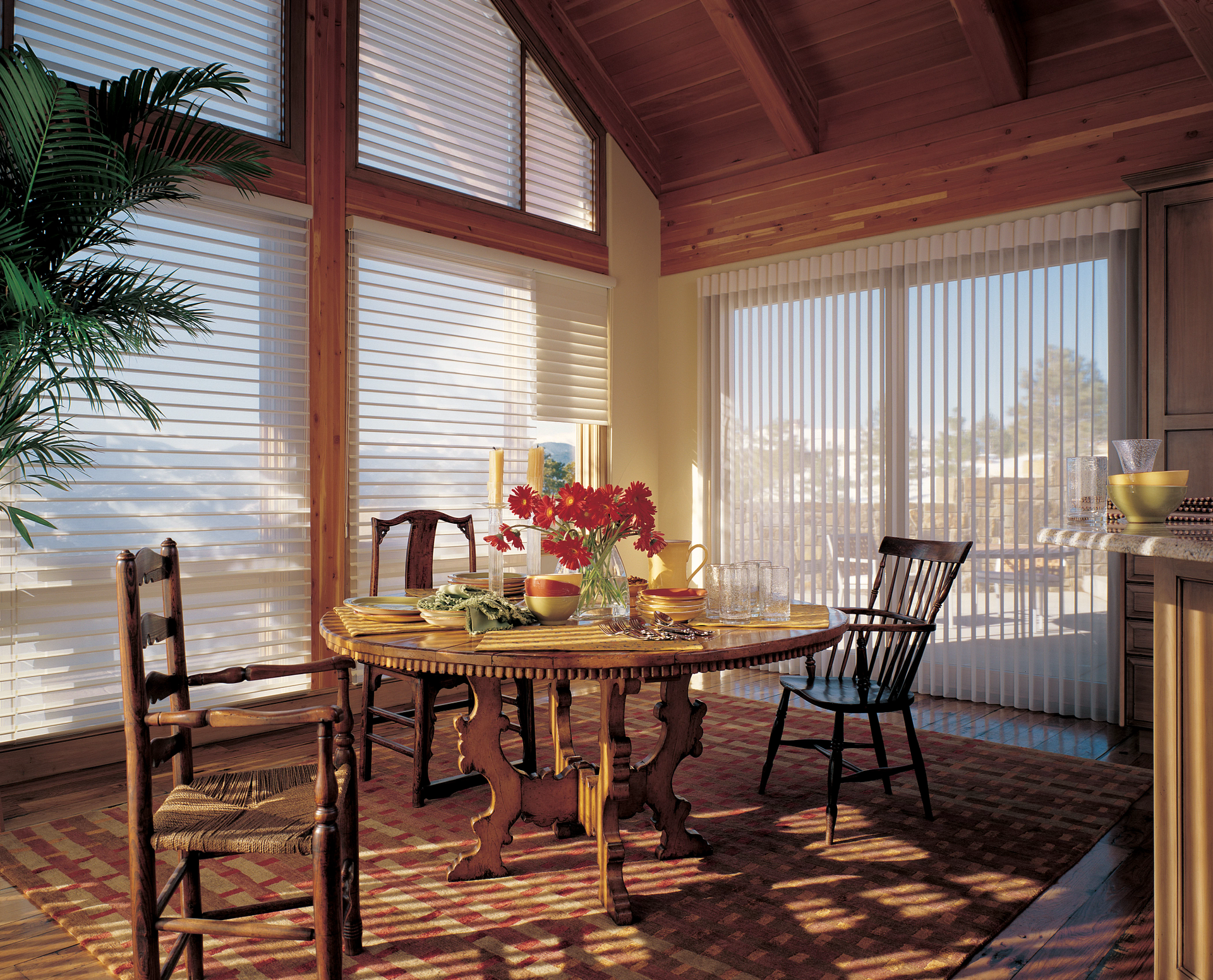 Silhouette® Sheer Shades hung vertically as a drape alternative on patio doors and horizontally on f