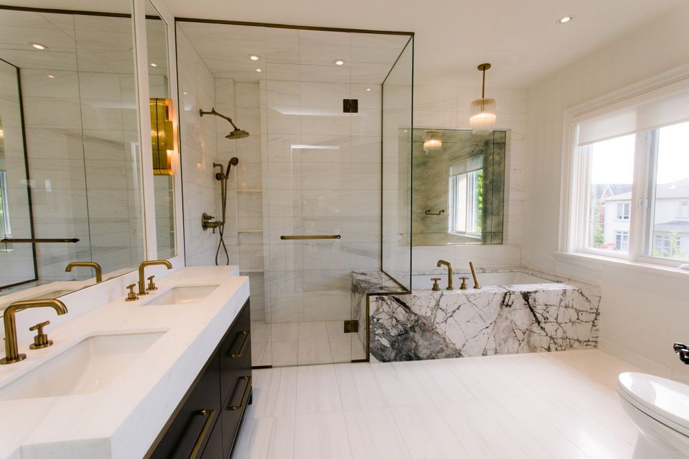 A Bathroom With Two Sinks, a Toilet, and a Walk in Shower — Leemark Design Services In Smithfield, QLD