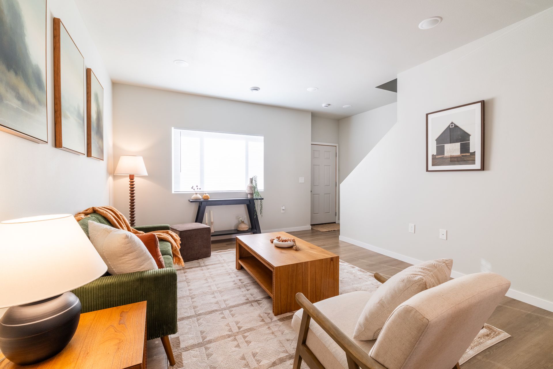 Living area with couches and chairs.