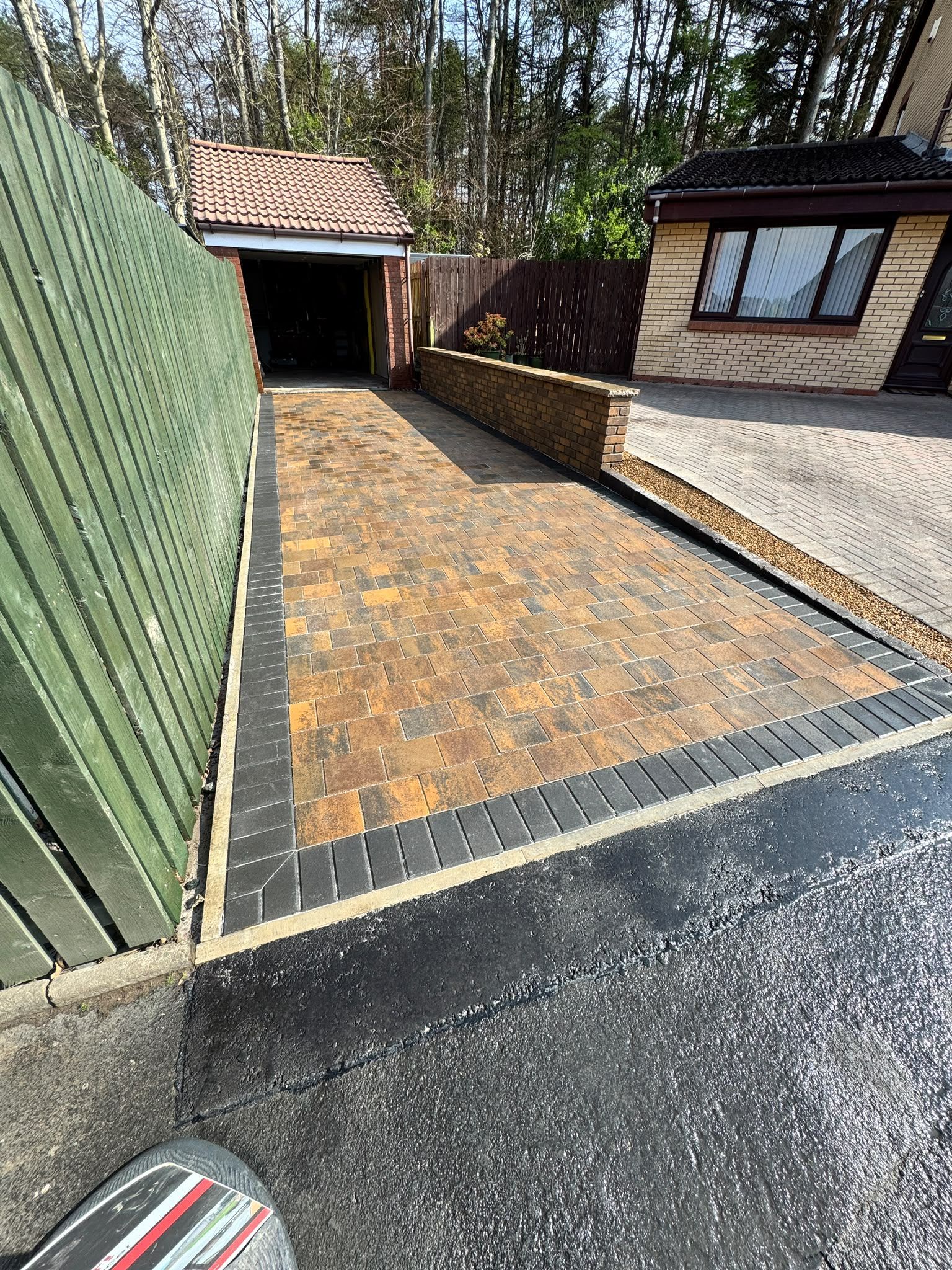 Bracken monoblock driveway with charcoal header course