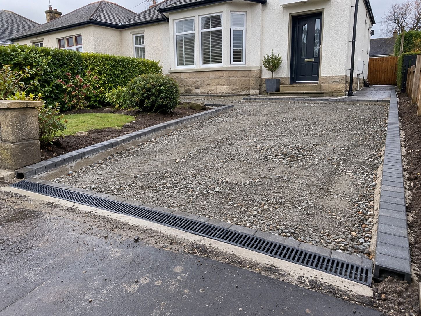Tarmac driveway excavation and compacted sub-base in Glasgow