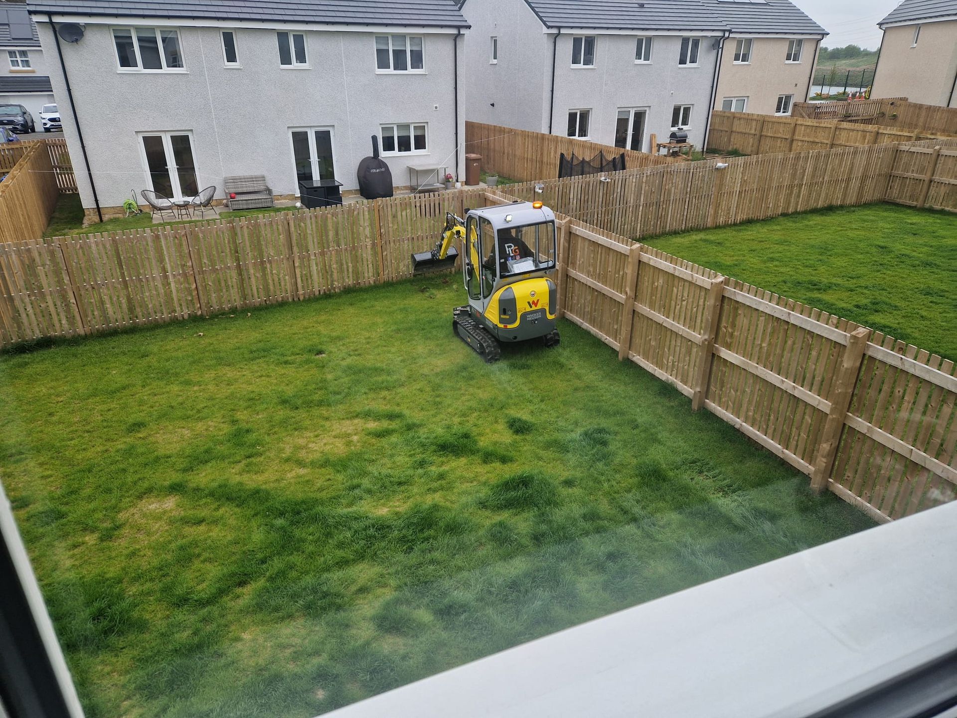 Grassed rear garden in Croy before the landscaping transformation began