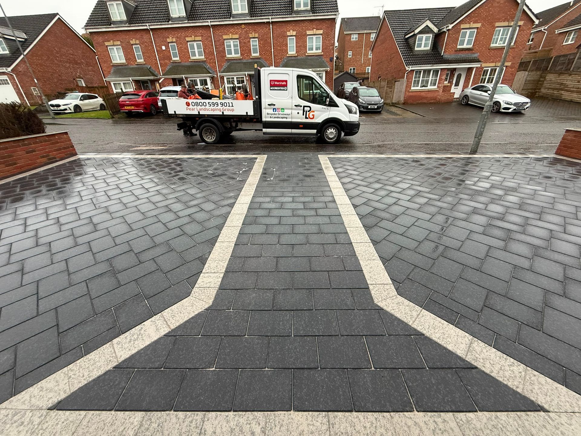 Completed Marshalls Lunar block-paved driveway with contrasting borders and central walkway in Glenboig