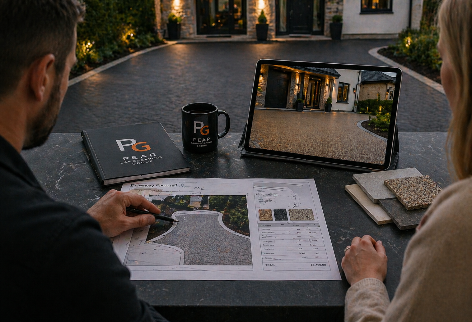 Driveway contractor consultation in Glasgow showing Pear Landscaping Group reviewing driveway plans, surface samples and design details before installation.