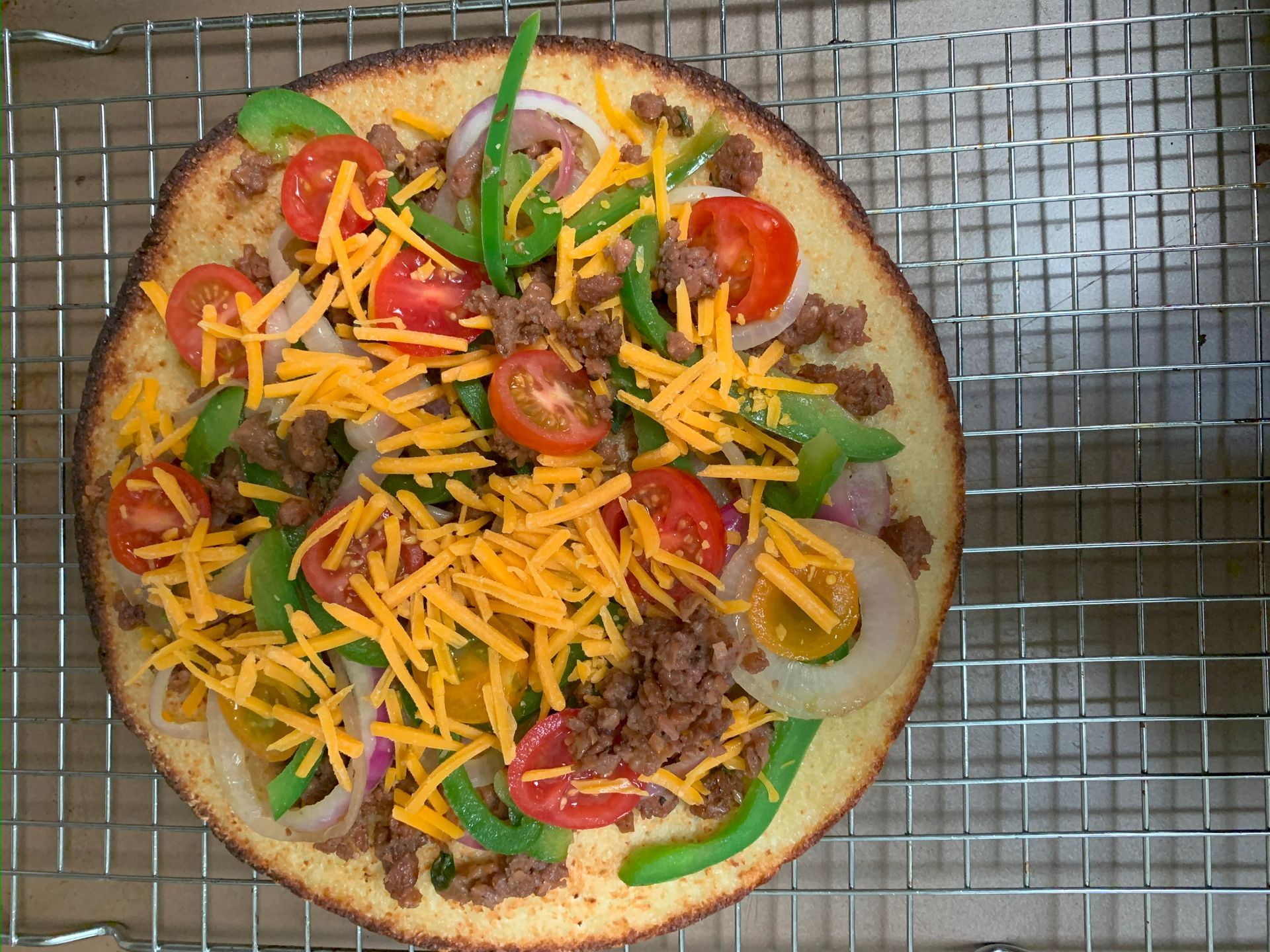 fresh notorious pizza with tomatoes and greens
