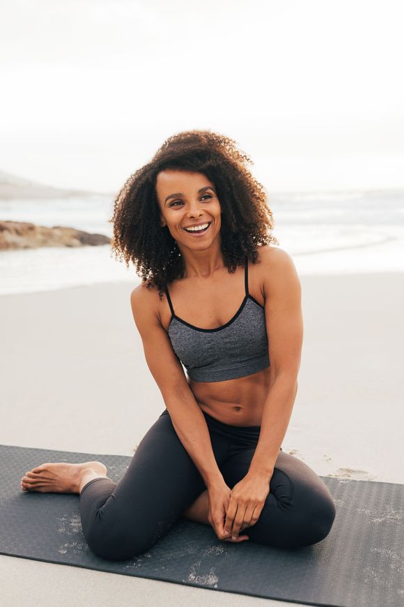 portrait young woman sitting beach