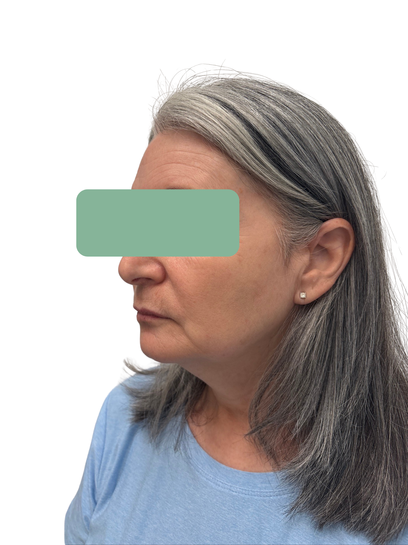 Side profile of a woman with long gray hair wearing a blue shirt against a white background
