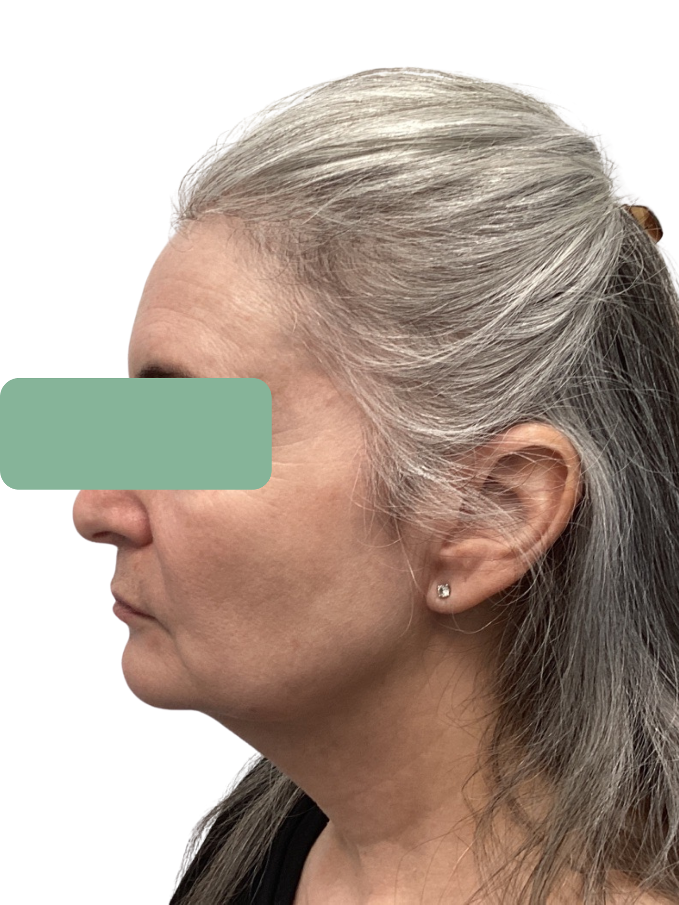 Side profile of a gray-haired person with a green bar covering the eyes.