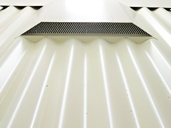 A Close Up of a White Roof With a Metal Grille on It — Vent Wise in Twin Waters, QLD