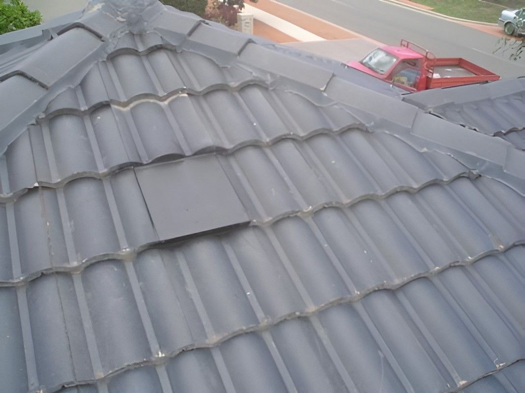 A Roof With a Red Car Parked in the Background — Vent Wise in Twin Waters, QLD