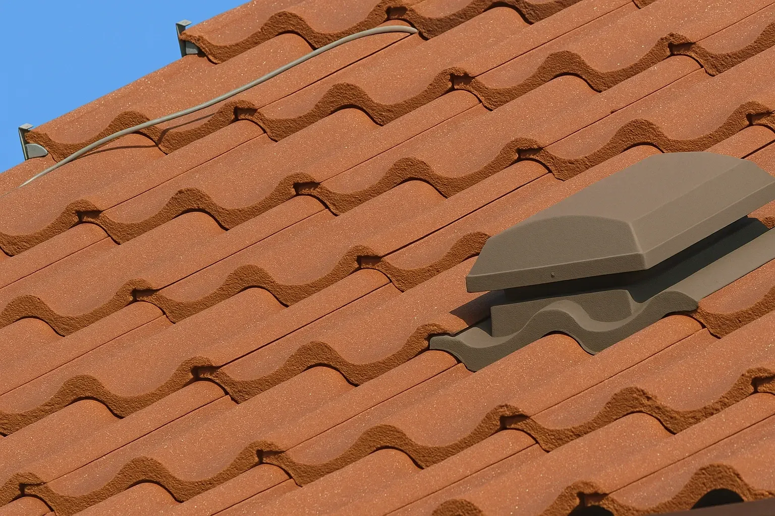 A close up of a tiled roof with a vent on it — Vent Wise in Canberra, ACT