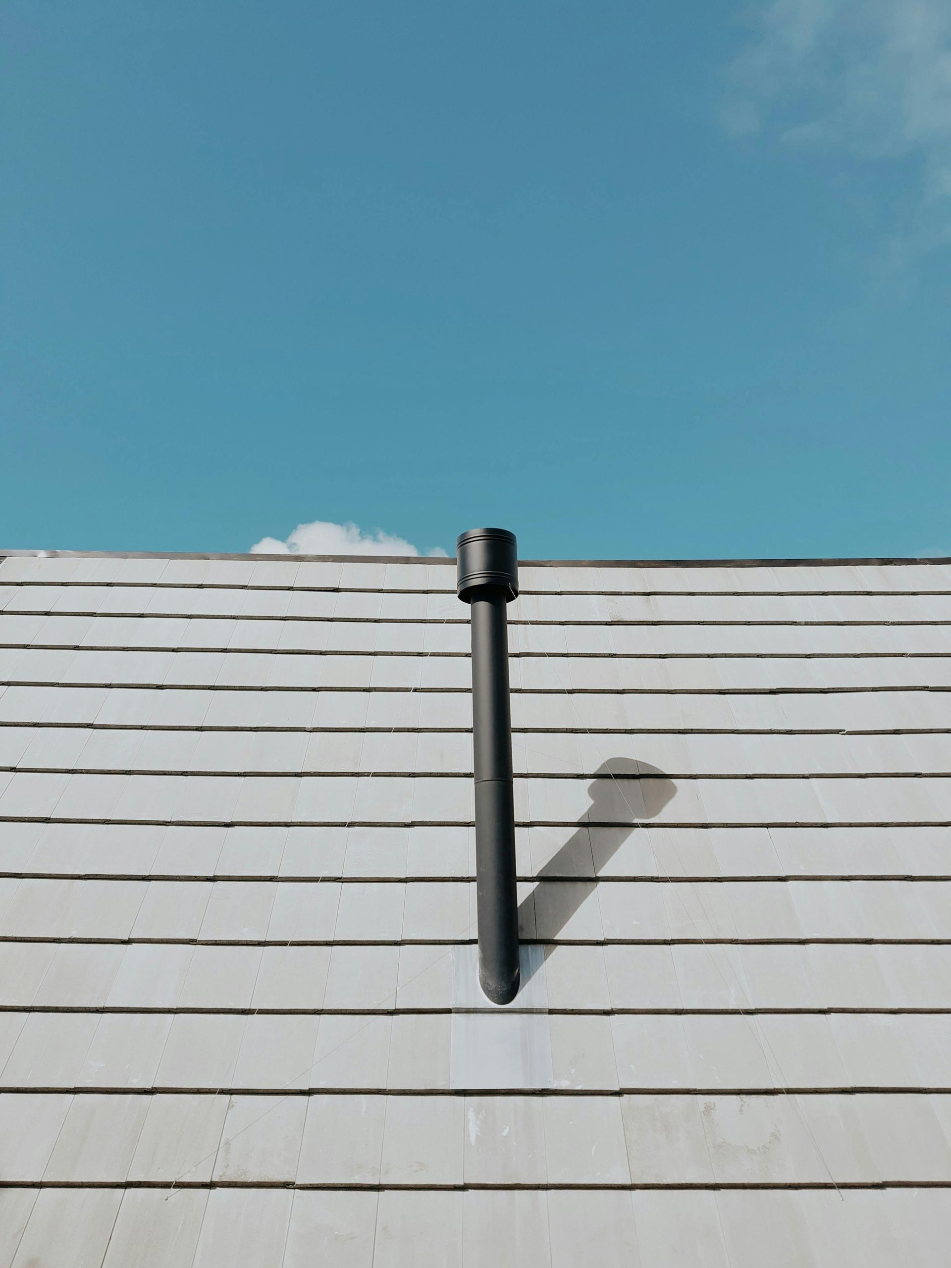 A Close Up of a Roof of a House With a Blue Sky in the Background — Vent Wise in Canberra, ACT
