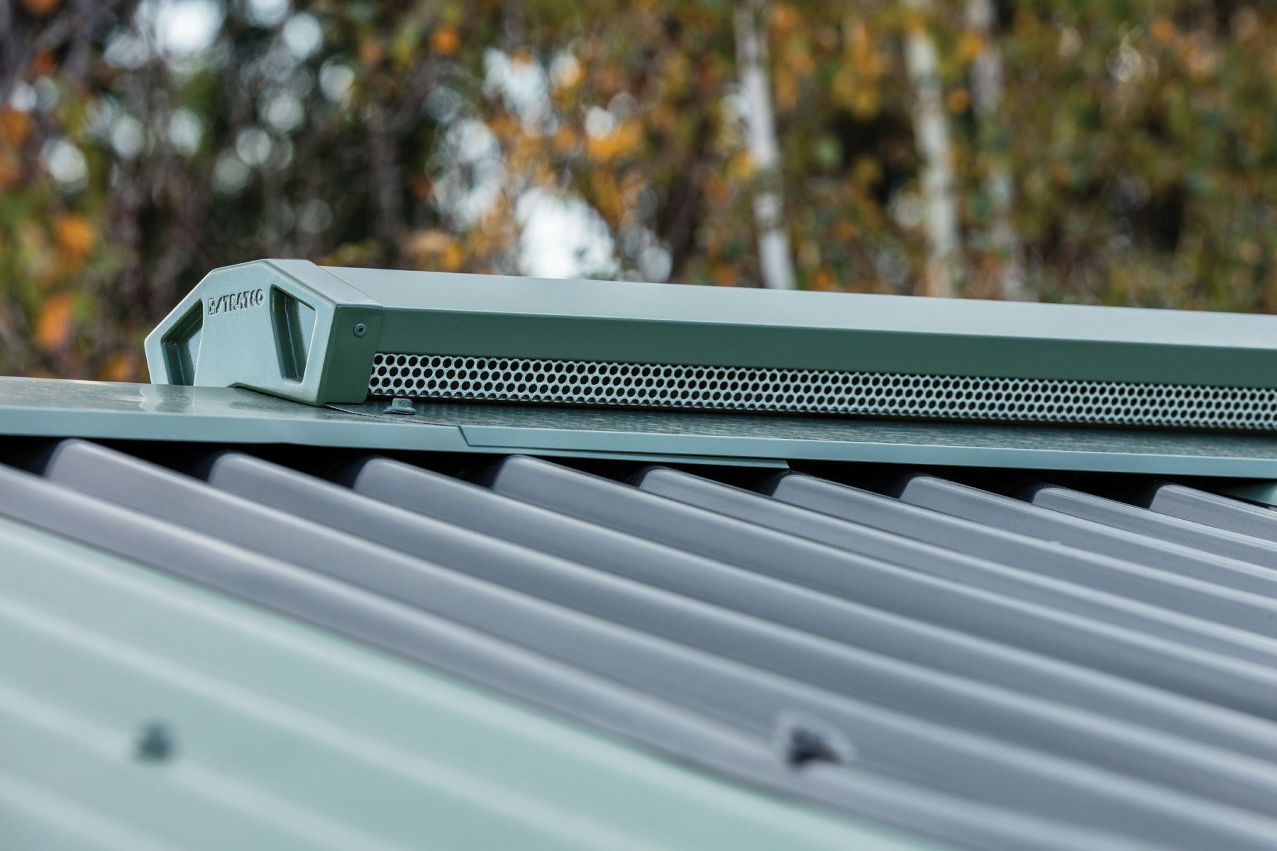 A close up of a tiled roof with a city in the background — Vent Wise in Twin Waters, QLD