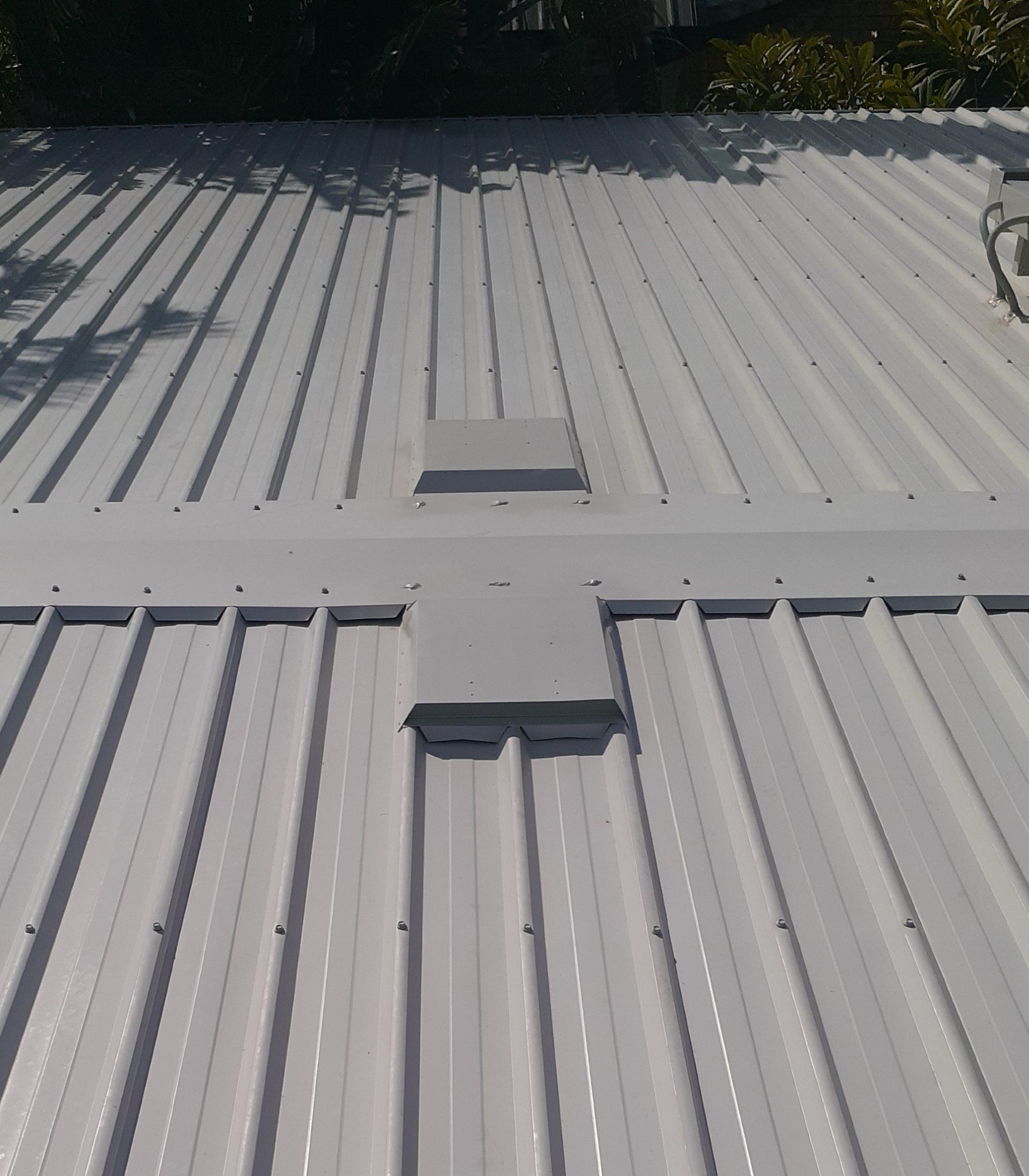 A Roof With a Lot of Tiles on It is Being Built — Vent Wise in Canberra, ACT