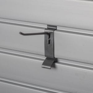 A metal hook is attached to a metal wall.