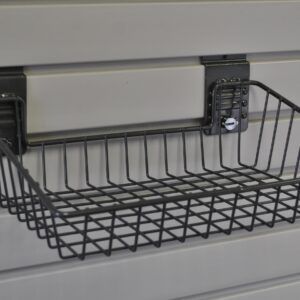 A wire basket is attached to a slat wall.