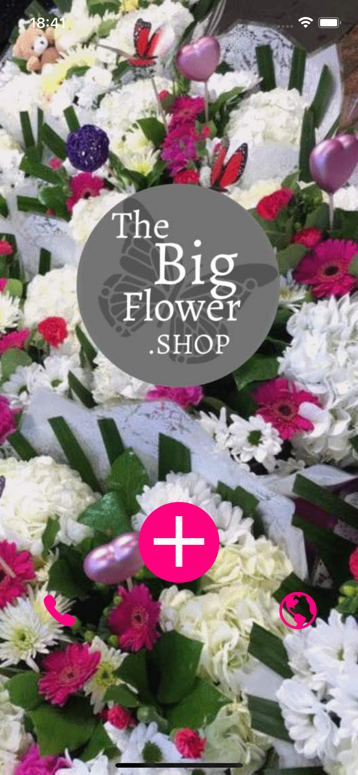 Close-up of a flower arrangement featuring white and pink blooms, with a shop's logo and a pink plus sign.
