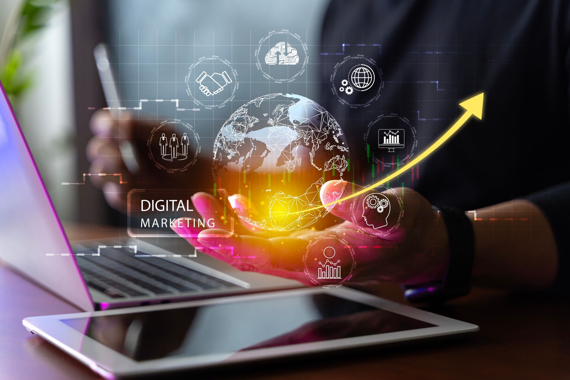 Hands using a laptop with digital marketing icons and an upward yellow growth arrow