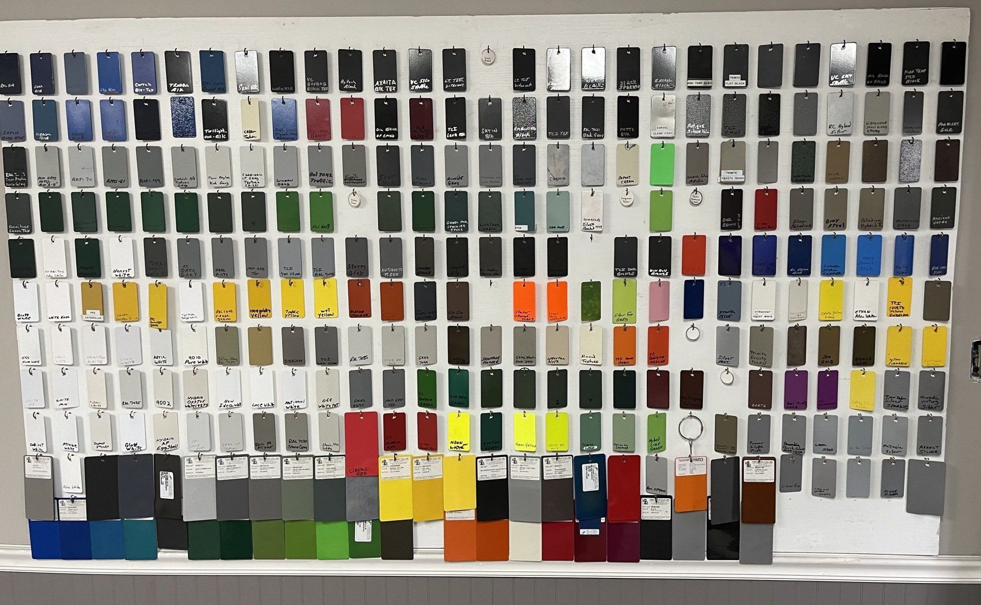 A Wall With a Bunch of Different Powder Coating Colors