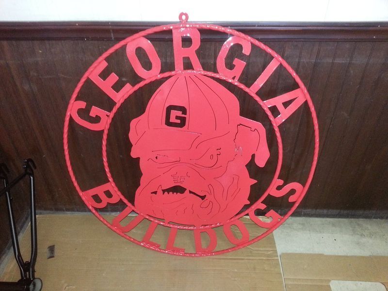 A Red Sign That Says Georgia Bulldogs on It