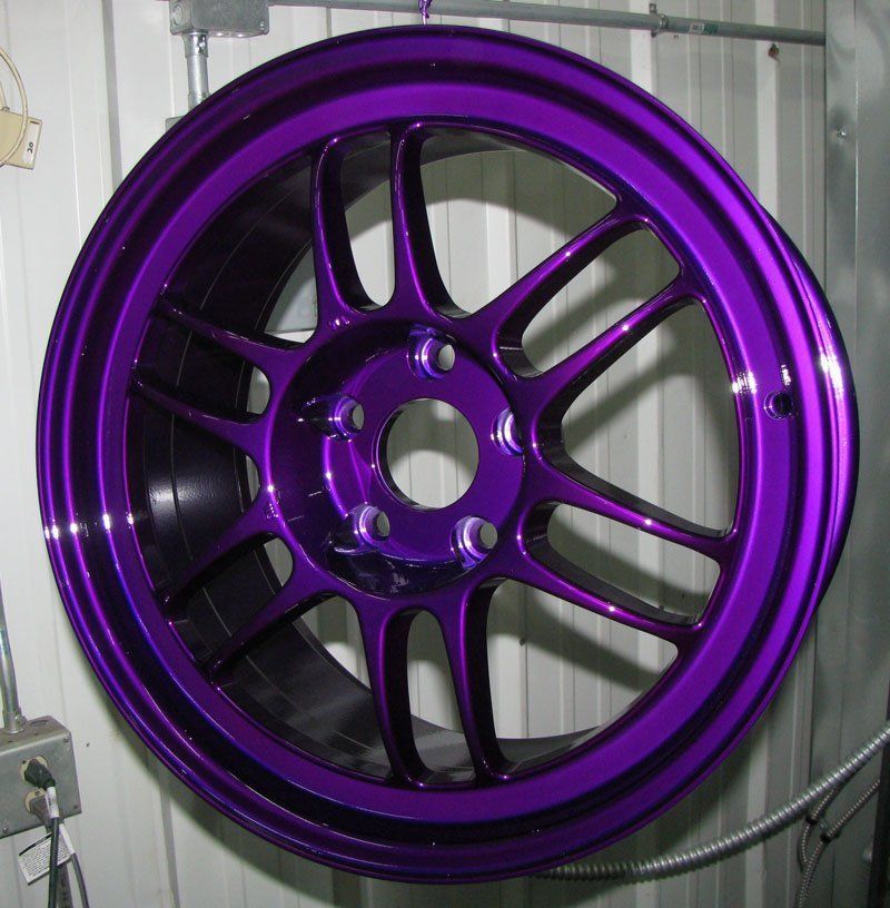 A Purple Wheel is Hanging on a Metal Wall