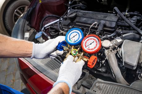 Mechanic working on a/c | Cain And Sons' Automotive