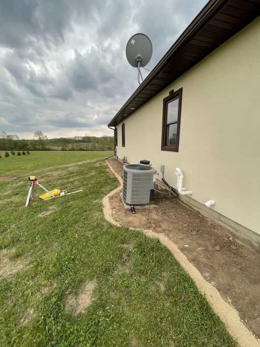 A house with a satellite dish on the side of it.