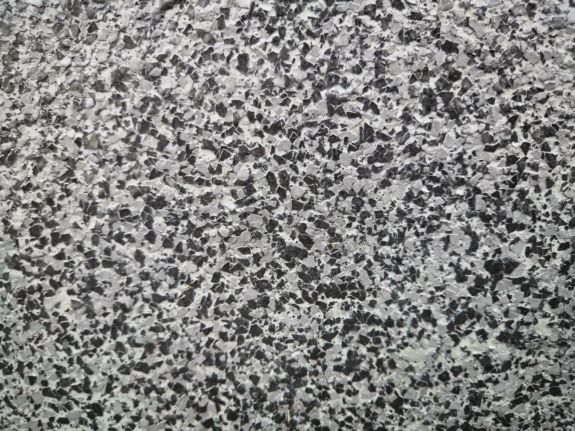 Close-up of a gray and black speckled granite surface