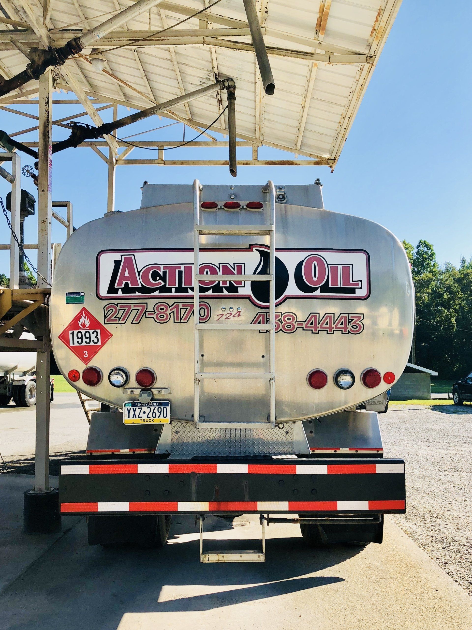 A Silver Action Oil Truck Is Parked Under A Canopy — Dunbar, PA — Action Oil