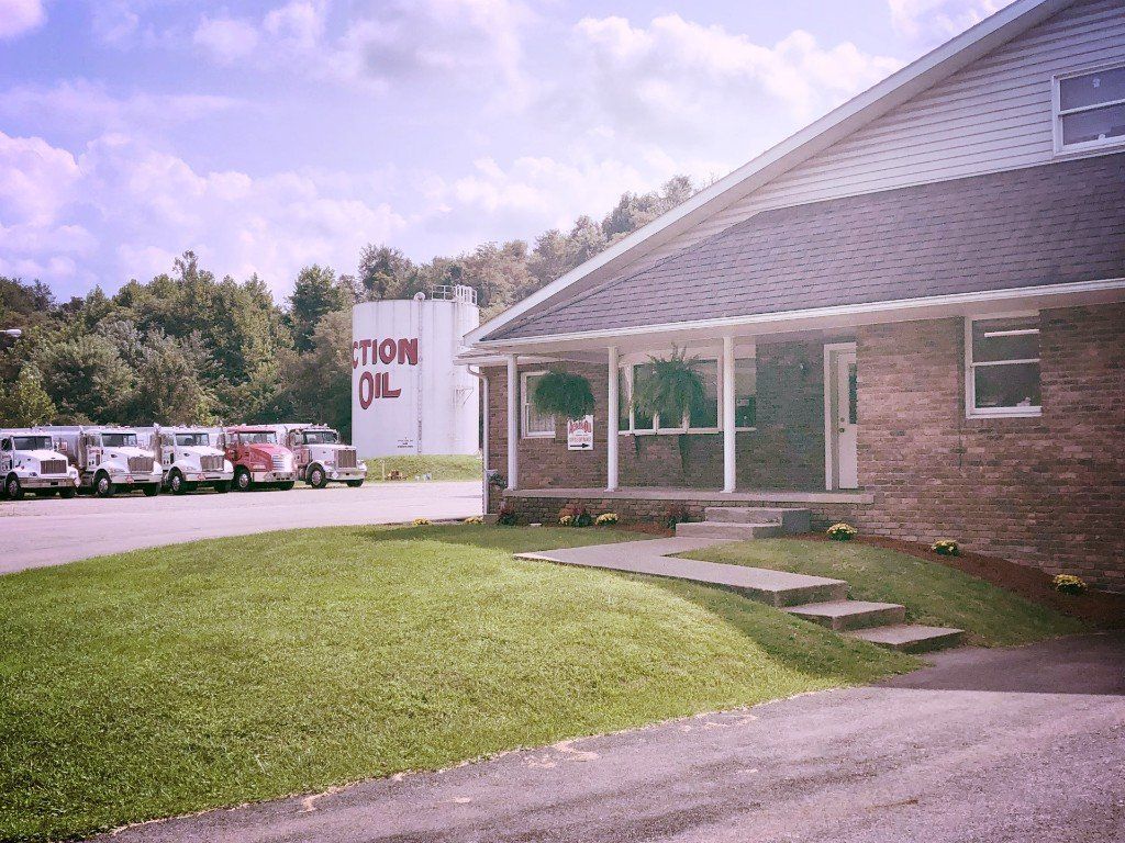 Several Trucks Are Parked In Front Of A Building — Dunbar, PA — Action Oil